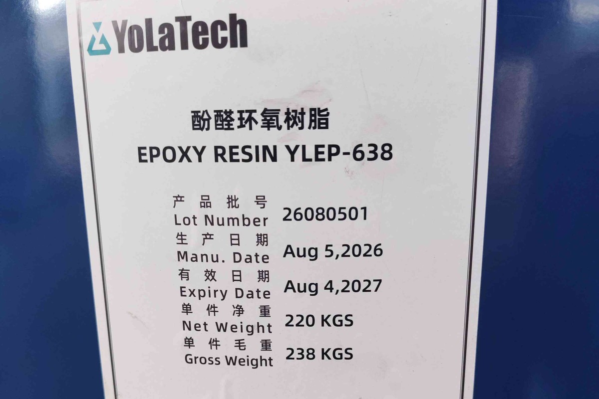 printed product label on a blue steel drum of YLEP-638 phenolic novolac epoxy resin, photographed in the warehouse